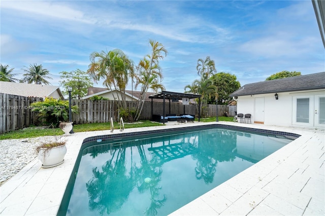 7354 NW 49th Ct, Lauderhill, FL 33319 - view of swimming pool with a pergola, a fenced in pool, a fenced backyard, french doors, and a patio