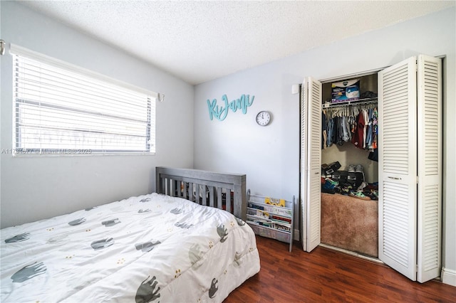 7354 NW 49th Ct, Lauderhill, FL 33319 - bedroom featuring a textured ceiling, wood finished floors, and a closet