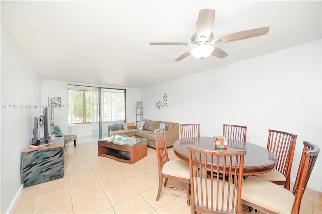 dining room featuring a ceiling fan and light tile patterned floors
