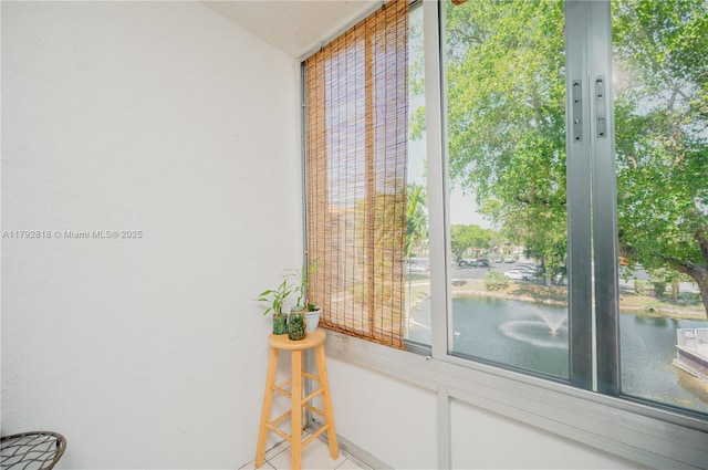 entryway featuring a water view and plenty of natural light