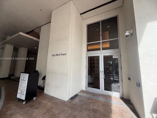 1050 Brickell Ave Unit 1602, Miami, FL 33131 - property entrance with stucco siding and french doors