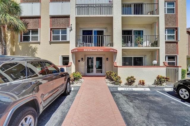 view of property with uncovered parking