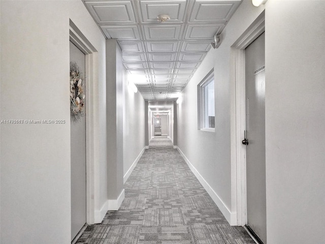400 N Riverside Dr Unit 512, Pompano Beach, FL 33062 - corridor featuring an ornate ceiling, carpet floors, and baseboards