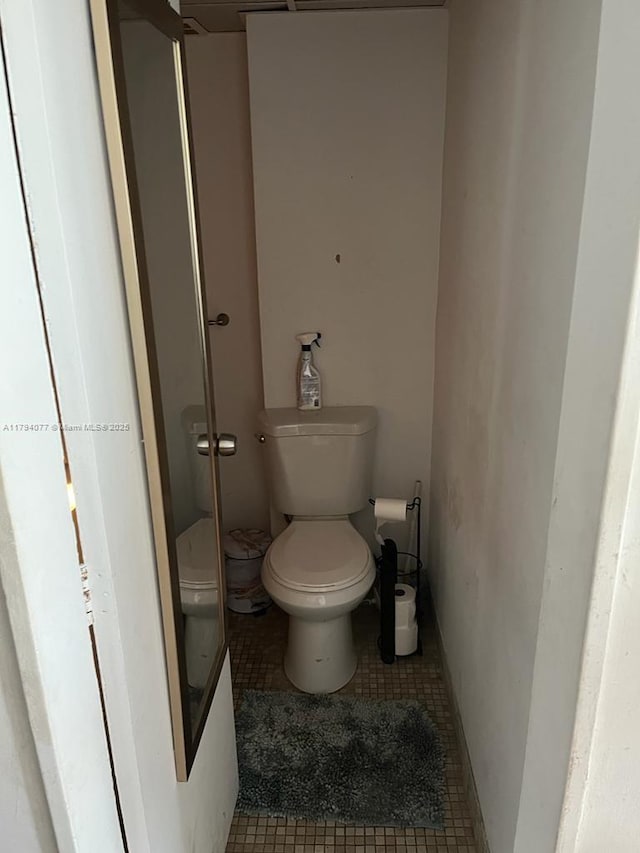 bathroom with tile patterned floors and toilet