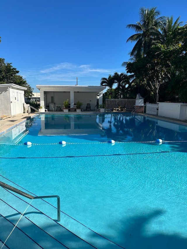 community pool featuring fence
