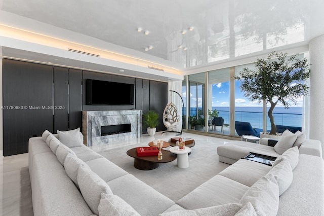 living room with visible vents and a premium fireplace