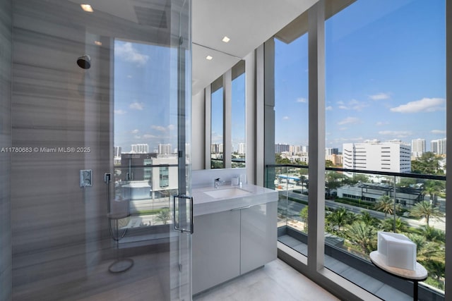 bathroom featuring a view of city and a shower stall