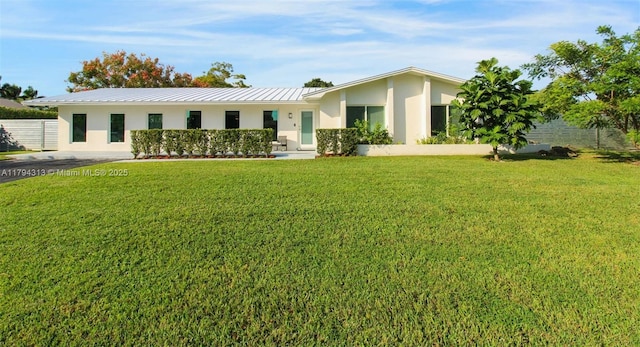 10861 SW 126th St, Miami, FL 33176 - exterior space with stucco siding, metal roof, a front yard, and a standing seam roof