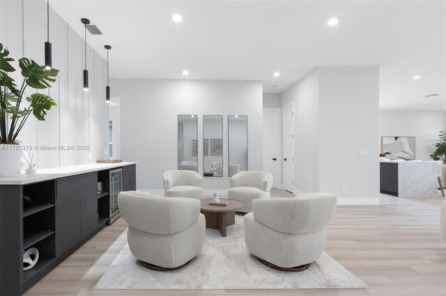 4629 Mariners Cove Dr, Wellington, FL 33449 - living area featuring light wood-style flooring, recessed lighting, and wine cooler