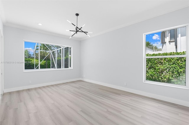 4629 Mariners Cove Dr, Wellington, FL 33449 - unfurnished room featuring a chandelier, light wood-style flooring, crown molding, and recessed lighting