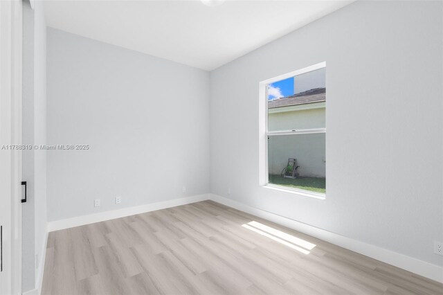 4629 Mariners Cove Dr, Wellington, FL 33449 - spare room featuring wood finished floors