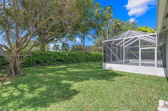 4629 Mariners Cove Dr, Wellington, FL 33449 - view of grassy yard featuring glass enclosure