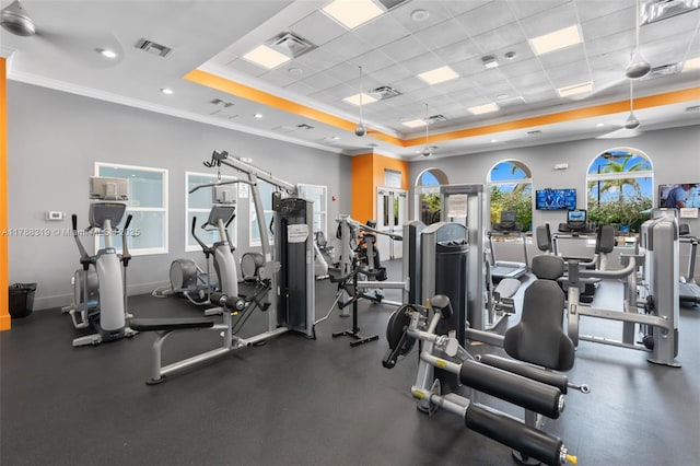 4629 Mariners Cove Dr, Wellington, FL 33449 - workout area featuring a tray ceiling, ornamental molding, and a paneled ceiling