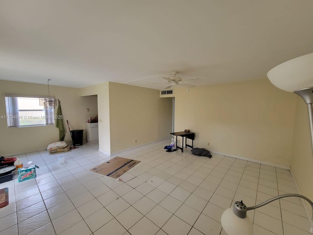 unfurnished living room featuring light tile patterned floors, baseboards, ceiling fan, and visible vents