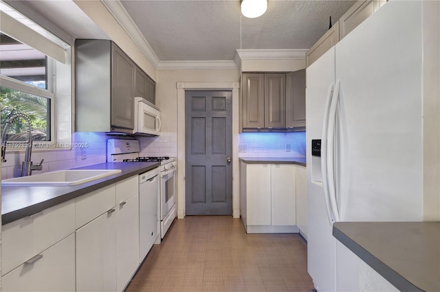 11450 NW 45th Pl, Sunrise, FL 33323 - kitchen with white appliances, a textured ceiling, a sink, and tasteful backsplash