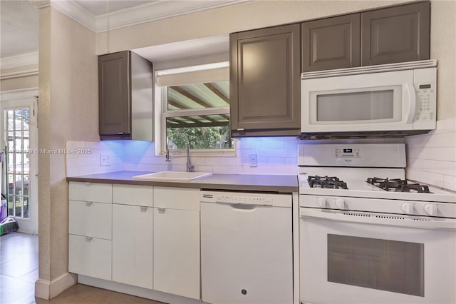 11450 NW 45th Pl, Sunrise, FL 33323 - kitchen featuring a sink, white appliances, plenty of natural light, decorative backsplash, and ornamental molding