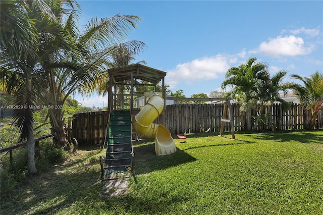 11450 NW 45th Pl, Sunrise, FL 33323 - view of jungle gym featuring fence and a yard