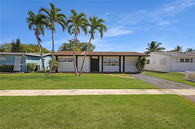11450 NW 45th Pl, Sunrise, FL 33323 - single story home featuring a front lawn