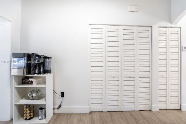 details with baseboards and wood finished floors