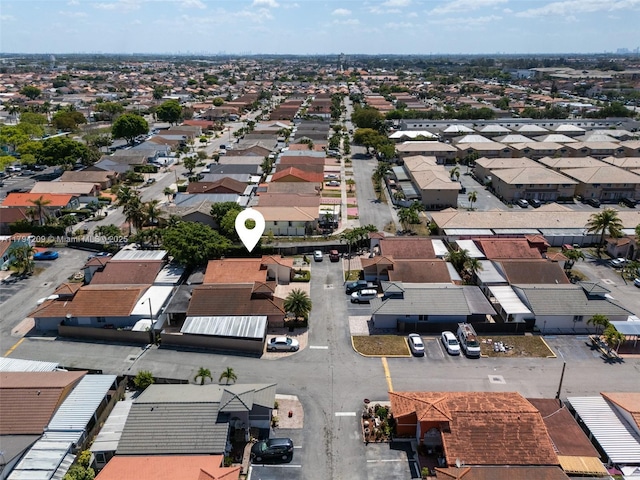 birds eye view of property with a residential view