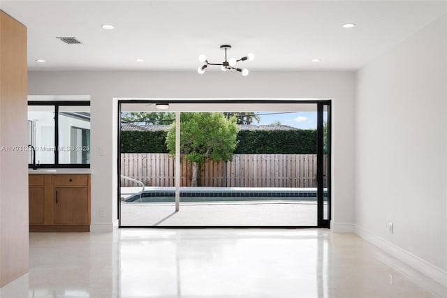 3420 NE 26th Ave, Lighthouse Point, FL 33064 - unfurnished room featuring a chandelier and recessed lighting