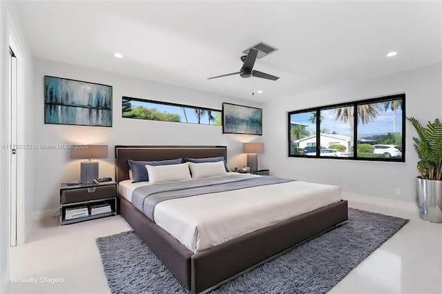 bedroom featuring recessed lighting, visible vents, and multiple windows