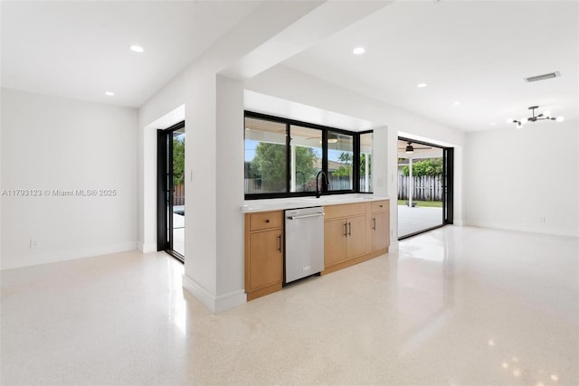 kitchen with a sink, light countertops, recessed lighting, stainless steel dishwasher, and visible vents