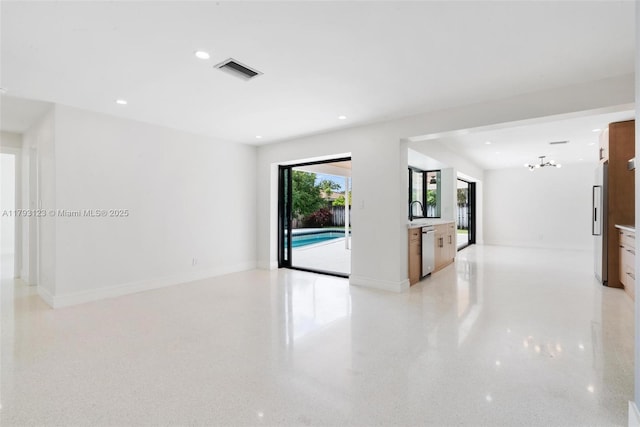 spare room with visible vents, recessed lighting, and baseboards