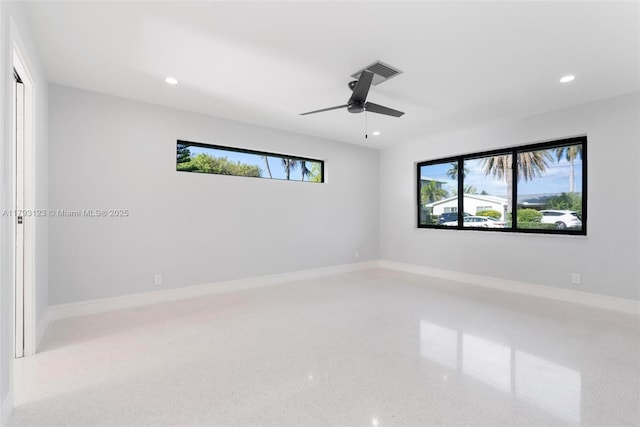 unfurnished room with a healthy amount of sunlight, recessed lighting, and visible vents