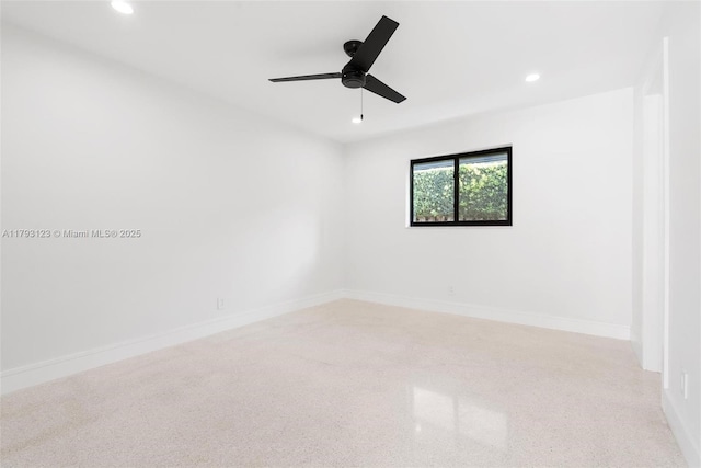 empty room with baseboards, ceiling fan, recessed lighting, and speckled floor