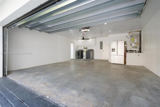 3420 NE 26th Ave, Lighthouse Point, FL 33064 - garage featuring white refrigerator with ice dispenser, a garage door opener, independent washer and dryer, heating unit, and electric panel