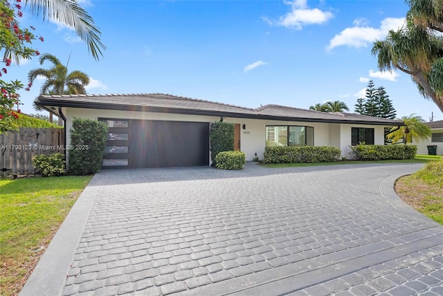 3420 NE 26th Ave, Lighthouse Point, FL 33064 - view of front of home featuring decorative driveway, an attached garage, and stucco siding
