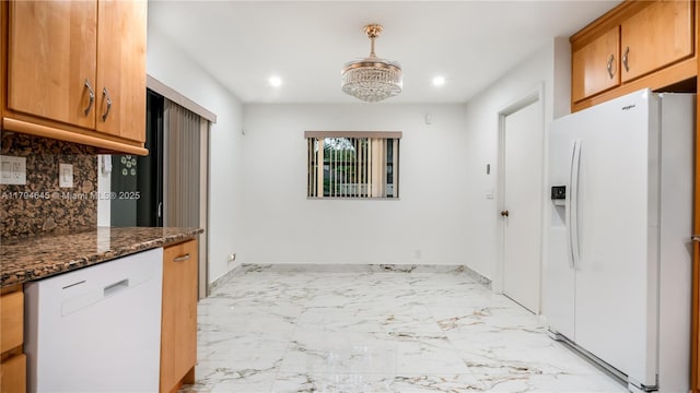 9866 NW 19th St, Coral Springs, FL 33071 - kitchen with recessed lighting, decorative backsplash, brown cabinetry, and white appliances