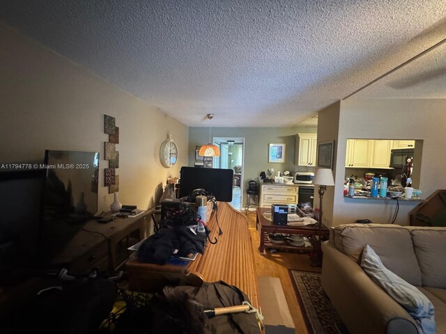 197 Kent L, West Palm Beach, FL 33417 - living room featuring a textured ceiling and wood finished floors