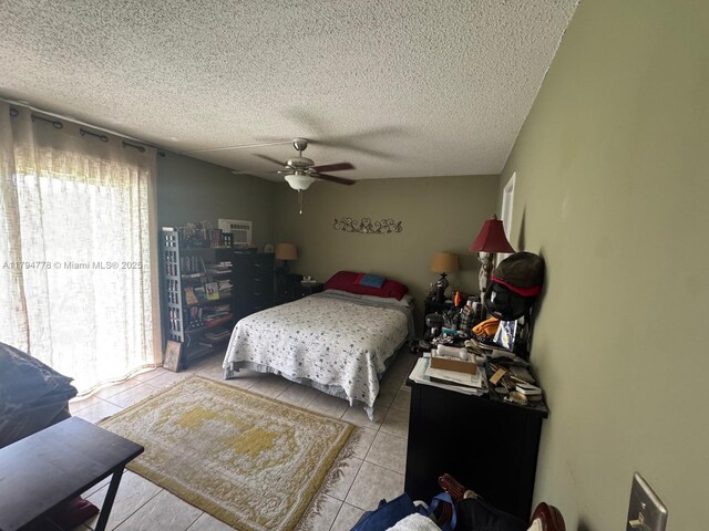 197 Kent L, West Palm Beach, FL 33417 - bedroom with light tile patterned floors, a textured ceiling, and a ceiling fan
