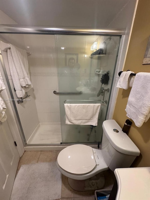 197 Kent L, West Palm Beach, FL 33417 - bathroom with a stall shower and tile patterned flooring
