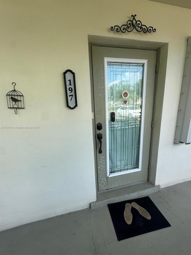 197 Kent L, West Palm Beach, FL 33417 - property entrance with stucco siding
