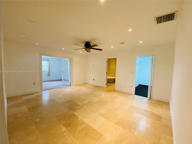spare room featuring visible vents, a ceiling fan, baseboards, and recessed lighting