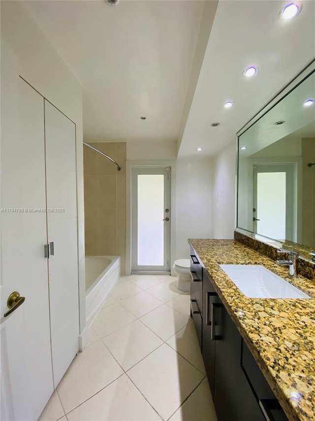 bathroom with vanity, toilet, tile patterned floors, recessed lighting, and shower / washtub combination