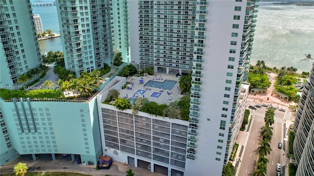 exterior space with a city view and a water view