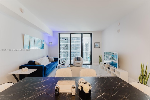 interior space with a wall of windows and marble finish floor