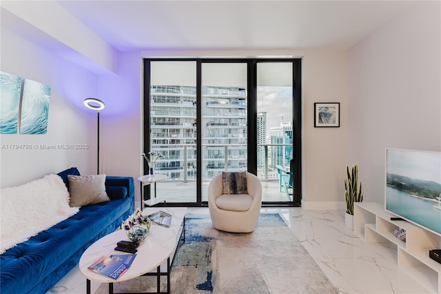 living area with marble finish floor