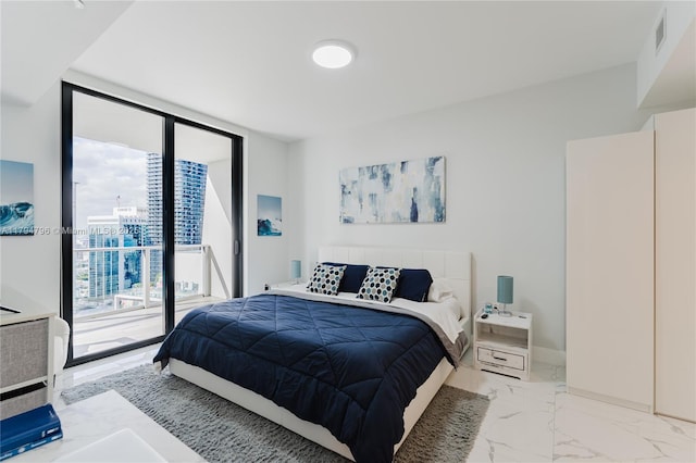 bedroom with a wall of windows, access to outside, and marble finish floor