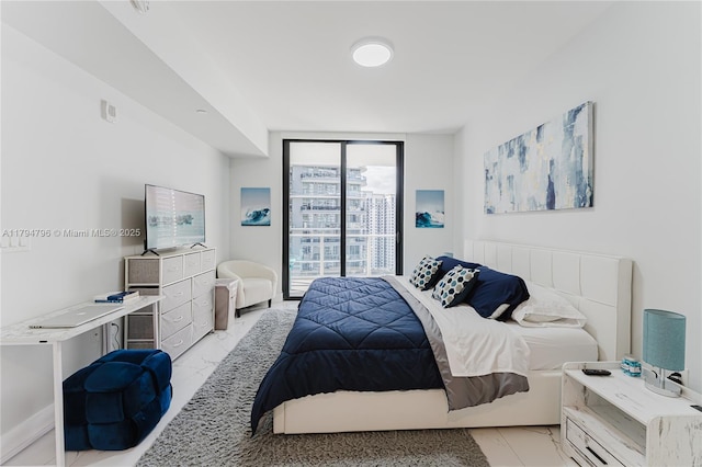 bedroom featuring access to outside, expansive windows, and marble finish floor