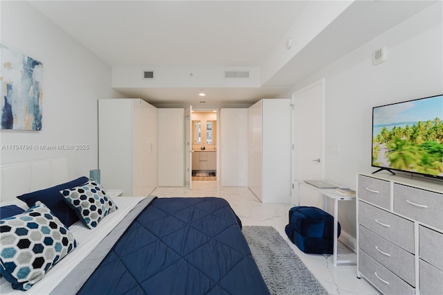 bedroom featuring recessed lighting, visible vents, ensuite bathroom, and marble finish floor
