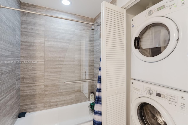 laundry room with recessed lighting and stacked washer / dryer