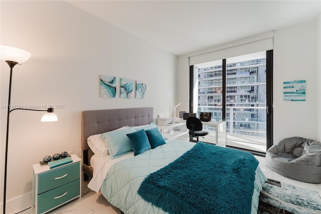 bedroom with floor to ceiling windows