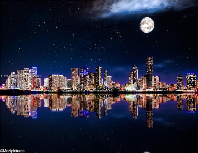 property's view of city with a water view