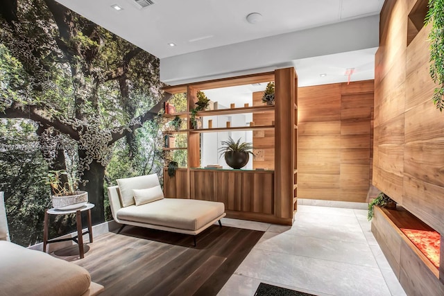 sitting room with wood walls