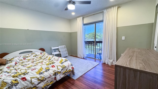 bedroom with access to outside, ceiling fan, a textured ceiling, baseboards, and wood finished floors